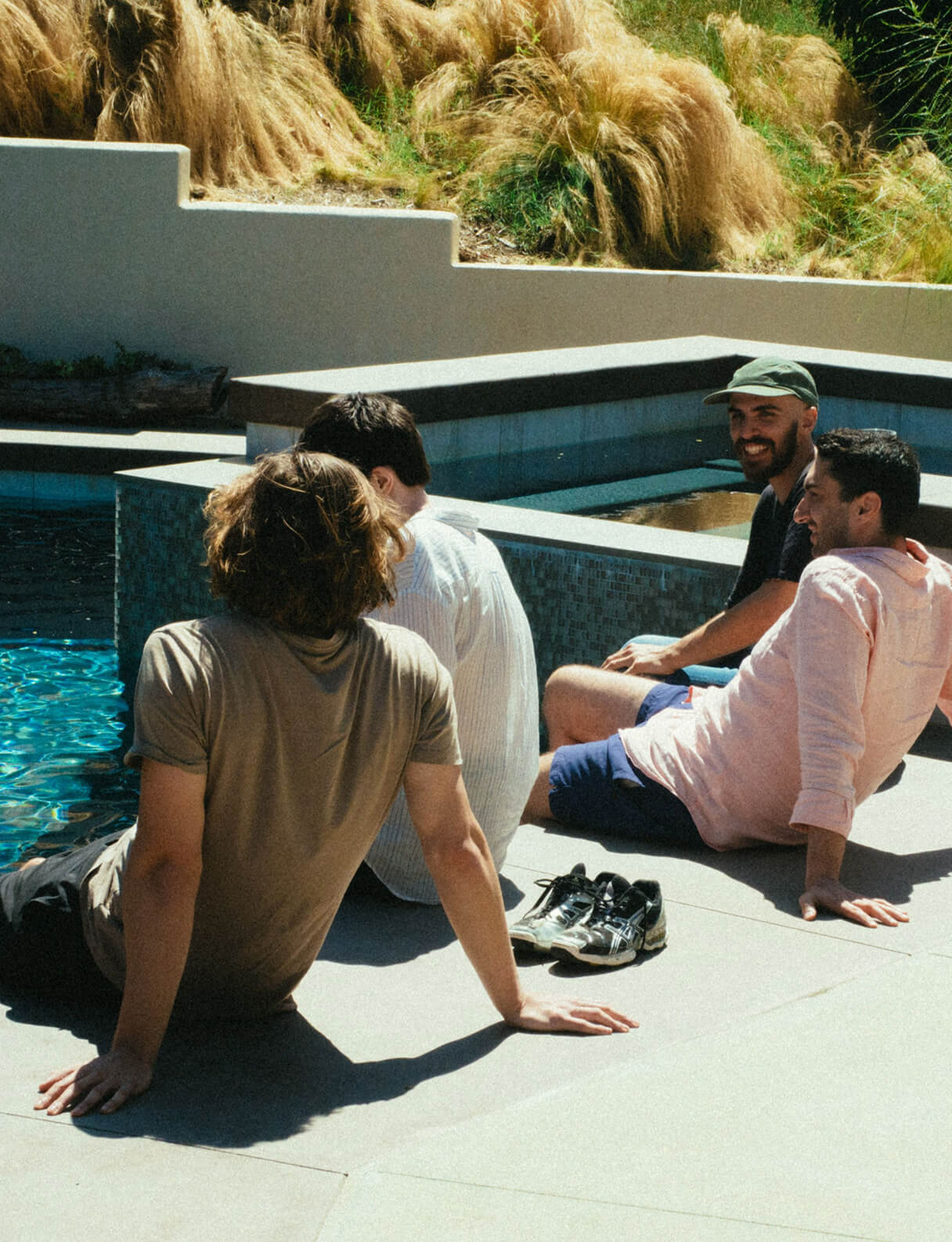 people sitting by pool