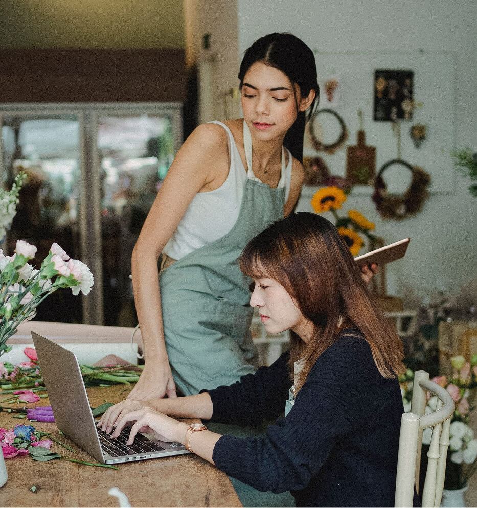 women looking at computer