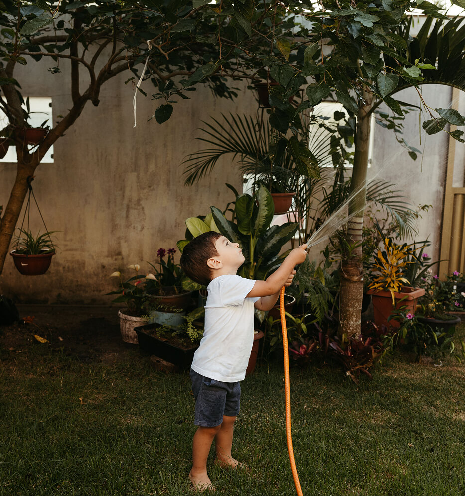child playing with hose