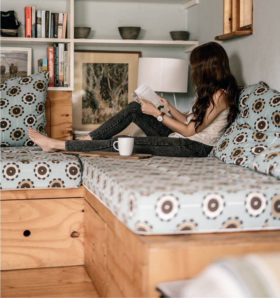woman reading on couch