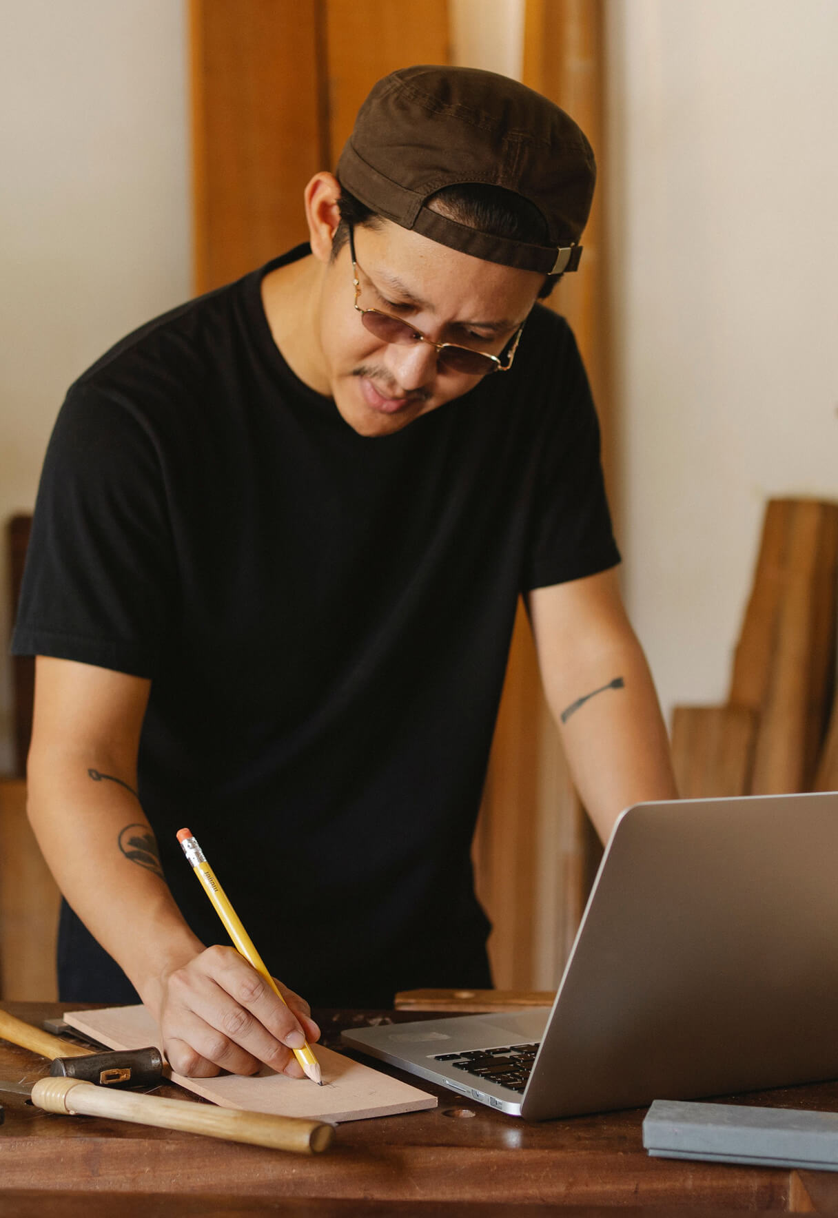 man writing on paper